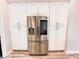 Modern kitchen with stainless steel french door refrigerator at 10411 Riverburn Dr, Tampa, FL 33647