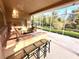 Outdoor kitchen with bar seating and grill at 10411 Riverburn Dr, Tampa, FL 33647