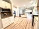 Modern kitchen with white cabinets, granite counters at 10411 Riverburn Dr, Tampa, FL 33647