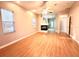 Bright bedroom featuring hardwood floors and a fireplace at 10411 Riverburn Dr, Tampa, FL 33647