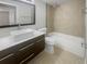 Bathroom with modern vanity and bathtub at 2400 Feather Sound Dr # 211, Clearwater, FL 33762