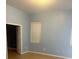 Spacious bedroom with light blue walls and wood-look floors at 10918 Ancient Futures Dr, Tampa, FL 33647