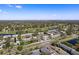 Stunning aerial view of the community, showcasing the lush landscaping and waterways with the city skyline in the background at 1951 Lakewood Club S Dr # B, St Petersburg, FL 33712