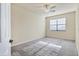 Well-lit bedroom with window blinds and ceiling fan at 20180 Ragazza Cir # 201, Venice, FL 34293