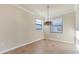 Dining area with tile floors and a modern light fixture at 20180 Ragazza Cir # 201, Venice, FL 34293