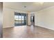 Bright living room with tile floors and access to a screened balcony at 20180 Ragazza Cir # 201, Venice, FL 34293