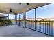 Spacious screened balcony overlooking a tranquil lake at 20180 Ragazza Cir # 201, Venice, FL 34293