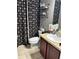 Clean bathroom with a shower/tub combo, and updated vanity at 15541 Stone House Dr, Brooksville, FL 34604