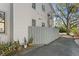 Private side yard with grey fence and potted plants at 911 S Rome Ave # 6, Tampa, FL 33606