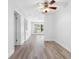 Spacious living area with vinyl flooring and a ceiling fan at 404 E Morgan St, Brandon, FL 33510