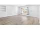 Living room featuring vinyl flooring and built-in shelving at 404 E Morgan St, Brandon, FL 33510