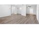 Spacious living room with light grey wood-look flooring at 404 E Morgan St, Brandon, FL 33510