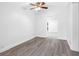 Spacious bedroom with gray vinyl flooring and ceiling fan at 404 E Morgan St, Brandon, FL 33510