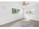 Well-lit bedroom featuring vinyl flooring and dual windows at 404 E Morgan St, Brandon, FL 33510