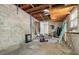 Unfinished basement with concrete floor and ample storage space at 404 E Morgan St, Brandon, FL 33510