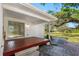 Red wooden deck with stairs leading to the backyard at 404 E Morgan St, Brandon, FL 33510