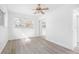 Bright bedroom with gray vinyl flooring and ceiling fan at 404 E Morgan St, Brandon, FL 33510