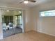 Bedroom with sliding glass doors leading to a screened porch at 1811 Mississippi Ne Ave, St Petersburg, FL 33703