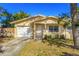 Ranch style home with attached garage and fenced yard at 1811 Mississippi Ne Ave, St Petersburg, FL 33703