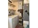 Bright laundry room with washer, dryer, and storage shelves at 1811 Mississippi Ne Ave, St Petersburg, FL 33703