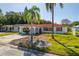 House exterior with damaged fence and landscaping at 4624 Compass Ct, New Port Richey, FL 34652