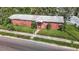 Aerial view of a brick home with a spacious yard and street parking at 3420 E 21St Ave, Tampa, FL 33605