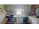 Small kitchen with white cabinets and appliances at 3420 E 21St Ave, Tampa, FL 33605