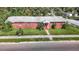 Aerial view of a brick home with a spacious yard and street parking at 3420 E 21St Ave, Tampa, FL 33605