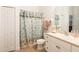 Clean bathroom with a shower/tub combo and updated vanity at 6801 Dali Ave # G205, Land O Lakes, FL 34637