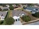 Elevated view of a home with a two-car driveway and front yard at 13267 Linzia Ln, Spring Hill, FL 34609