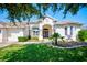 Single-story home with a two-car garage and inviting front porch at 13267 Linzia Ln, Spring Hill, FL 34609