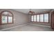 Bedroom featuring shuttered windows, neutral color scheme, ceiling fan and decorative molding at 3418 Braeside Pl, Clearwater, FL 33759