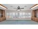 Spacious bedroom featuring shutters, built-in cabinets and beautiful water views at 3418 Braeside Pl, Clearwater, FL 33759