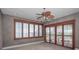Bedroom featuring shuttered windows, neutral color scheme, ceiling fan and decorative molding at 3418 Braeside Pl, Clearwater, FL 33759