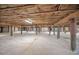 Exposed wooden beams and support columns in a clean and spacious crawlspace area at 3418 Braeside Pl, Clearwater, FL 33759