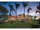 Beautiful home with a clay tile roof, arched entry, and well-maintained lawn at 3418 Braeside Pl, Clearwater, FL 33759