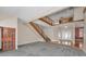 Open-concept foyer with hardwood floors, staircase, and views to an upper level loft at 3418 Braeside Pl, Clearwater, FL 33759