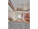 Bright foyer with hardwood floors, staircase, and soaring ceilings at 3418 Braeside Pl, Clearwater, FL 33759