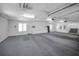 Spacious garage with clean walls and floors, equipped with ample lighting and storage cabinets at 3418 Braeside Pl, Clearwater, FL 33759