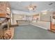 Open living area features a brick fireplace and pool table, ideal for gatherings and relaxation at 3418 Braeside Pl, Clearwater, FL 33759