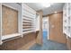 Walk-in closet with shelving and a view of the hallway and fan in the adjacent room at 3418 Braeside Pl, Clearwater, FL 33759