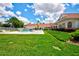 Community pool and clubhouse with green lawn at 13267 Linzia Ln, Spring Hill, FL 34609