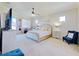 Spacious main bedroom with large bed and sitting area at 13267 Linzia Ln, Spring Hill, FL 34609