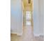 Long hallway leading to Primary bathroom at 13267 Linzia Ln, Spring Hill, FL 34609