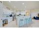 Well-equipped kitchen with white cabinets and a breakfast bar at 13267 Linzia Ln, Spring Hill, FL 34609