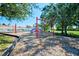 playground with swings and play structure at 13267 Linzia Ln, Spring Hill, FL 34609