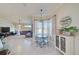 Casual dining area with table and chairs, adjacent to living room at 13267 Linzia Ln, Spring Hill, FL 34609