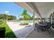 Refreshing pool area with patio seating and lush landscaping at 13267 Linzia Ln, Spring Hill, FL 34609