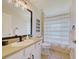 Clean bathroom with white vanity, single sink, and shower/tub combo at 13267 Linzia Ln, Spring Hill, FL 34609
