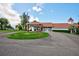 Community clubhouse exterior with circular driveway and landscaping at 13267 Linzia Ln, Spring Hill, FL 34609